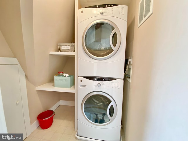 washroom with stacked washer / dryer