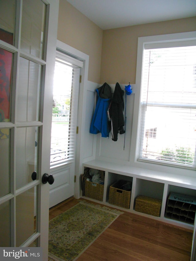 mudroom with hardwood / wood-style flooring and french doors