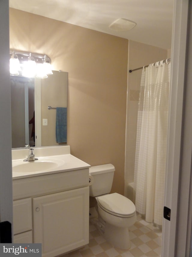 full bathroom with vanity, shower / bathtub combination with curtain, and toilet