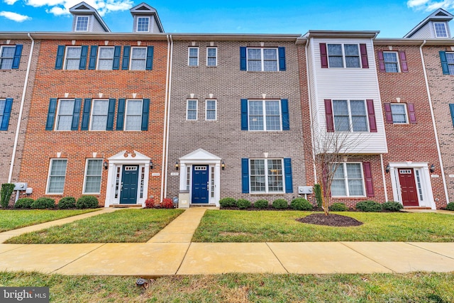 view of property with a front lawn