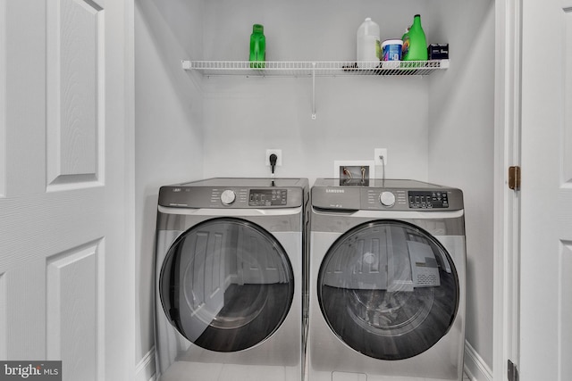 washroom with independent washer and dryer