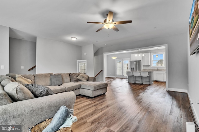 living room with ceiling fan and hardwood / wood-style floors