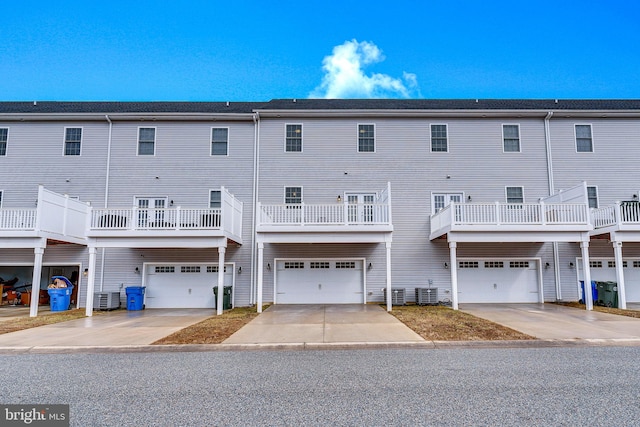 rear view of property featuring central AC