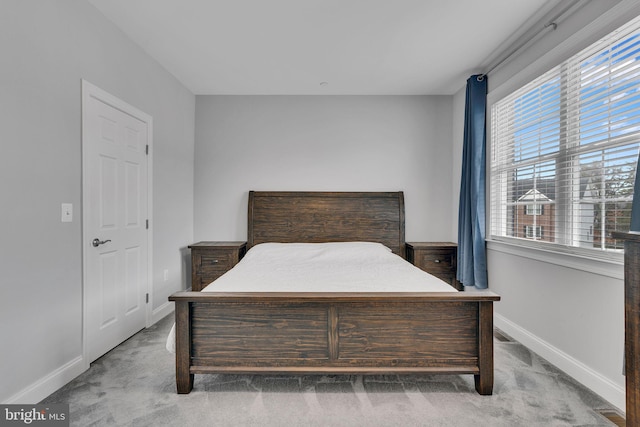 bedroom with light carpet