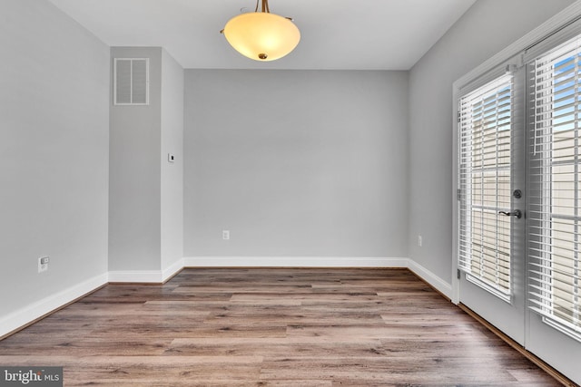 empty room featuring wood-type flooring