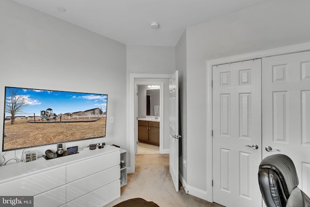 carpeted bedroom featuring a closet