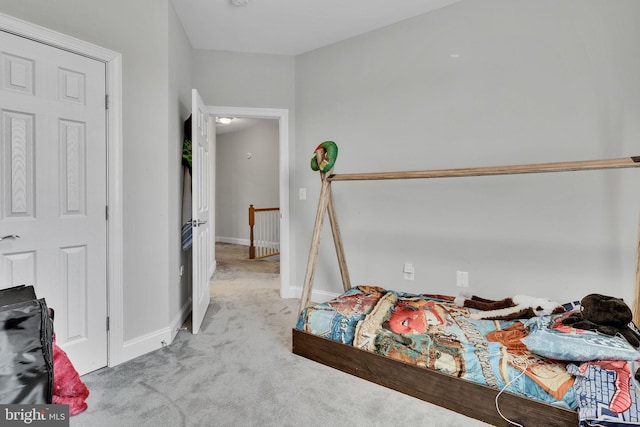 bedroom featuring light colored carpet