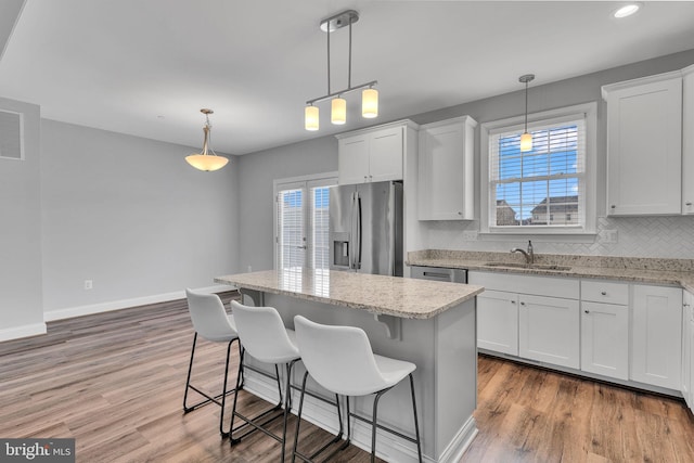 kitchen featuring white cabinetry, sink, and stainless steel appliances