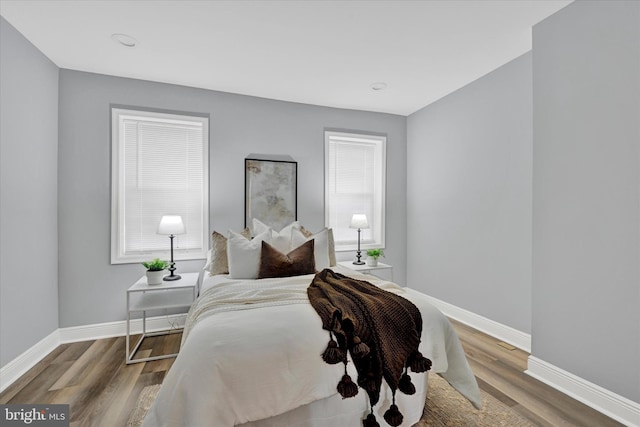 bedroom with wood-type flooring