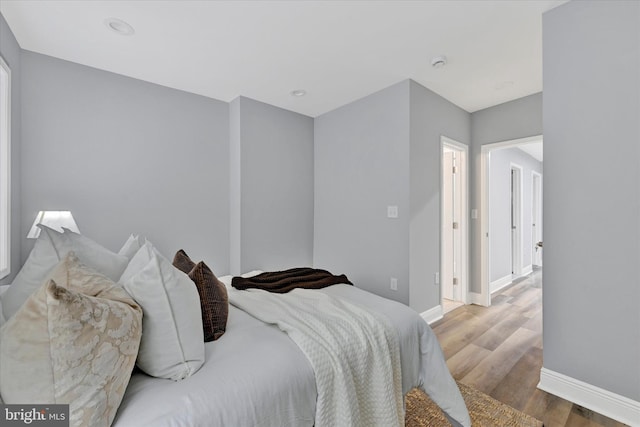 bedroom with light hardwood / wood-style floors