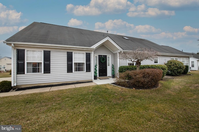 ranch-style home with a front lawn