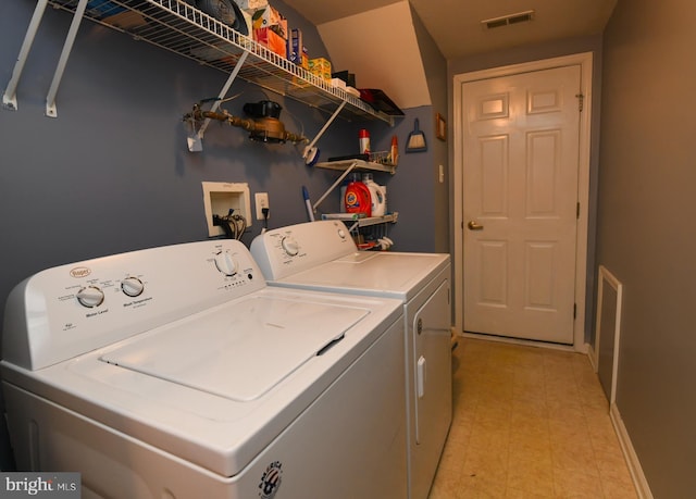 laundry area with washer and dryer