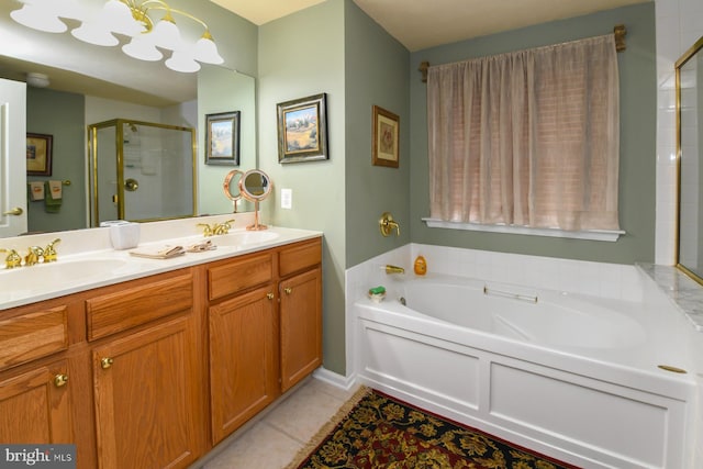 bathroom with vanity, tile patterned floors, plus walk in shower, and an inviting chandelier