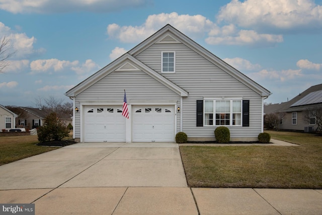 view of front of house with a garage and a front lawn