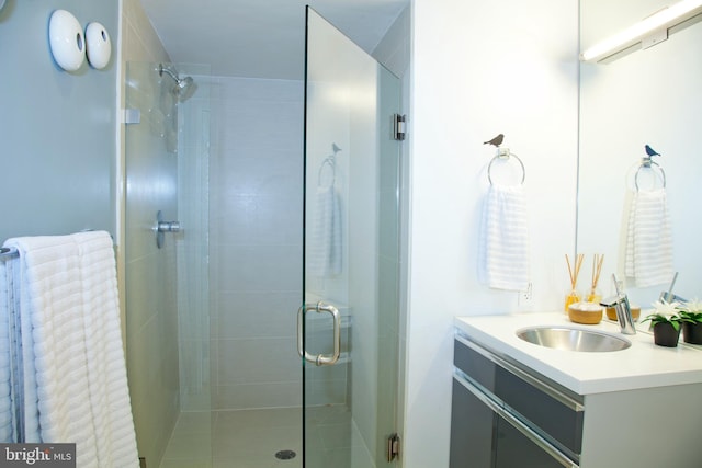 bathroom featuring vanity and a stall shower