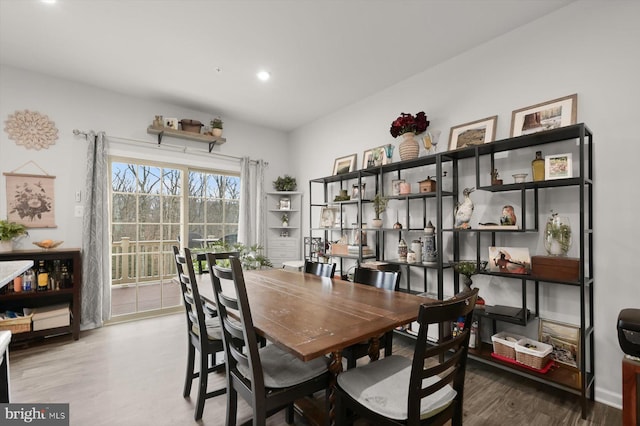 dining room with recessed lighting and wood finished floors