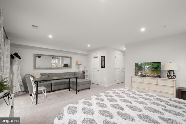 bedroom featuring light carpet, visible vents, and recessed lighting