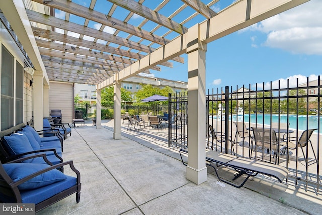 view of patio featuring a community pool, fence, and a pergola