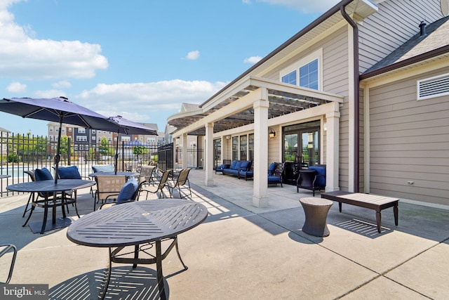 view of patio / terrace with fence and french doors