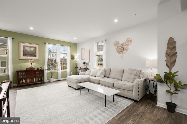 living area with baseboards, dark wood-style flooring, and recessed lighting