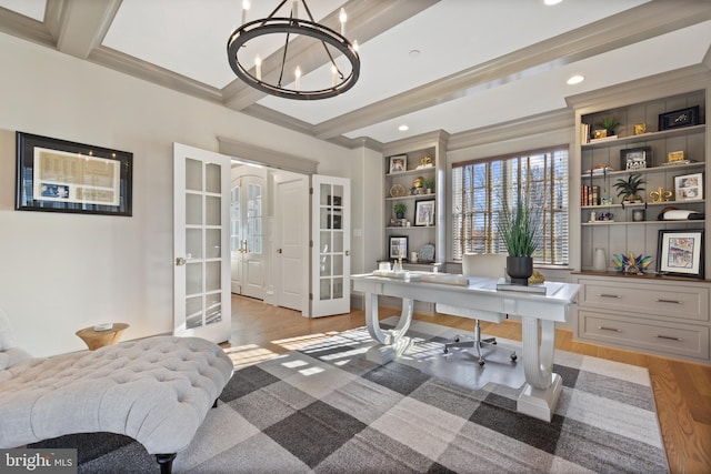 office featuring a notable chandelier, beam ceiling, light hardwood / wood-style floors, and french doors