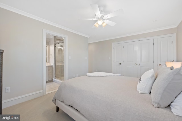 carpeted bedroom with connected bathroom, ornamental molding, a closet, and ceiling fan