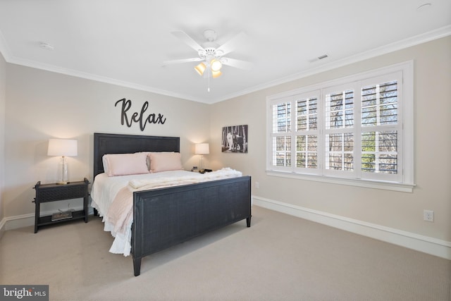 carpeted bedroom with crown molding and ceiling fan