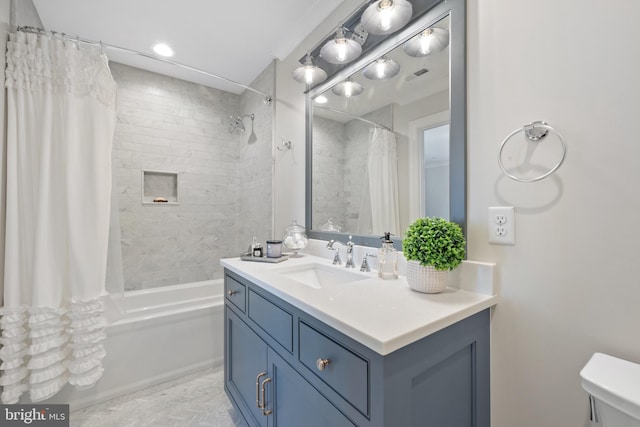 bathroom featuring vanity and shower / bath combo