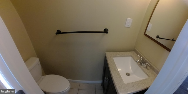 bathroom featuring vanity, tile patterned floors, and toilet