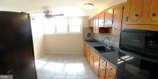 kitchen featuring tasteful backsplash, sink, black appliances, and ceiling fan