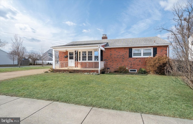 view of front of house with a front lawn and covered porch