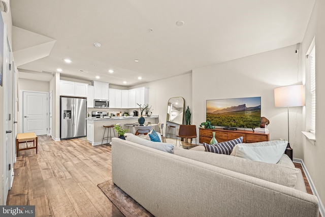 living room featuring light wood-type flooring