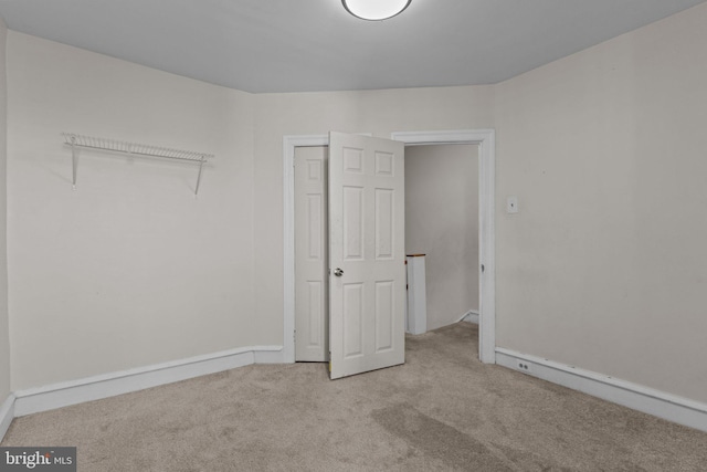 spare room with light carpet