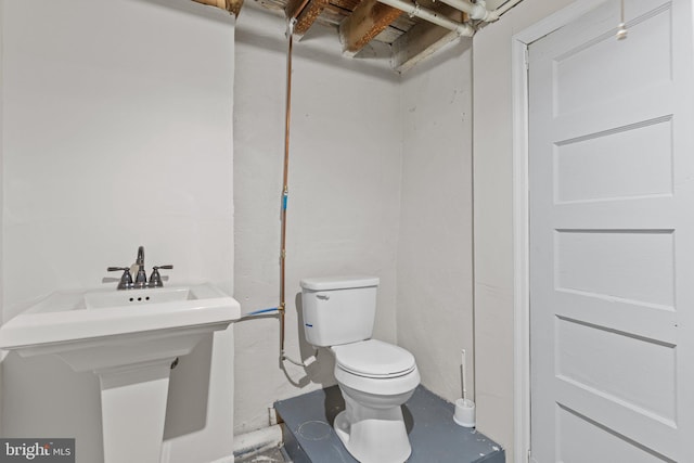 bathroom with toilet and sink