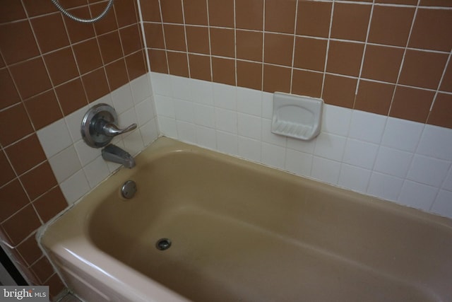 bathroom with a washtub