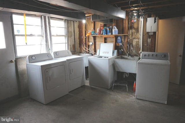 laundry room featuring washer and clothes dryer and sink