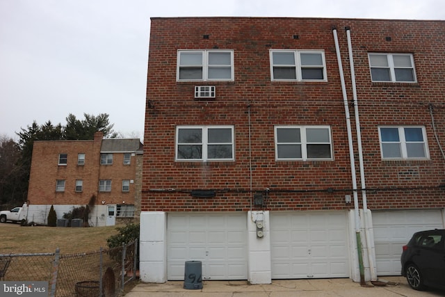 rear view of house featuring a garage