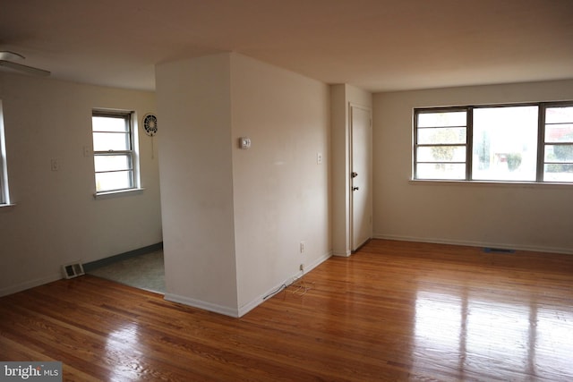 spare room with hardwood / wood-style floors