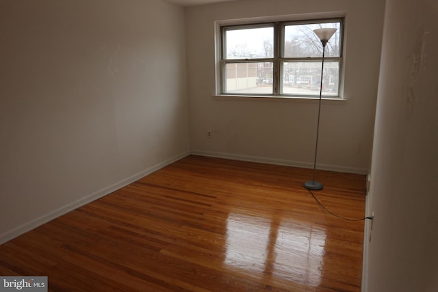 unfurnished room featuring wood-type flooring