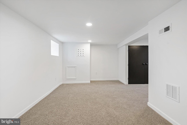 basement with carpet flooring