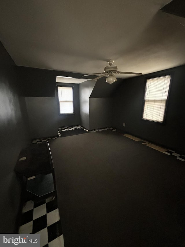 spare room with vaulted ceiling and ceiling fan