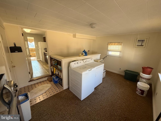 clothes washing area with laundry area, carpet, and separate washer and dryer