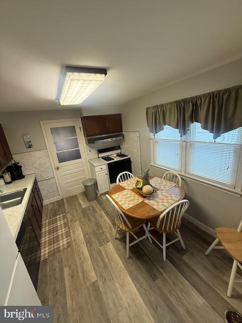 dining area with wood finished floors