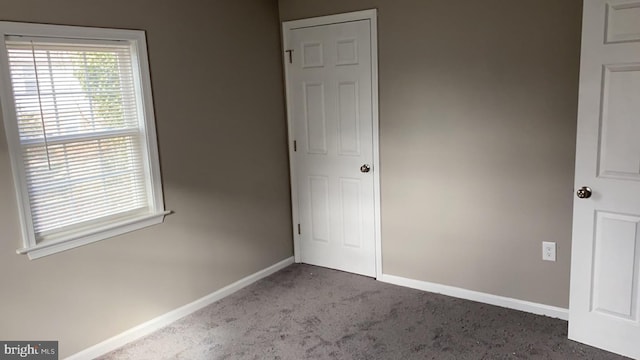 unfurnished bedroom with carpet floors