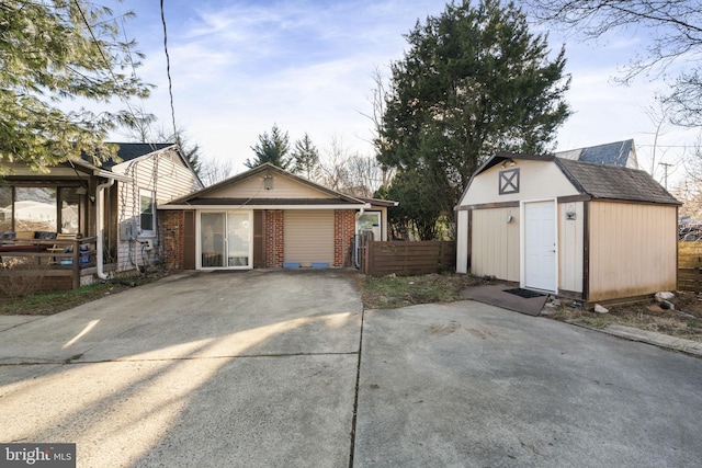 view of side of property featuring a storage shed