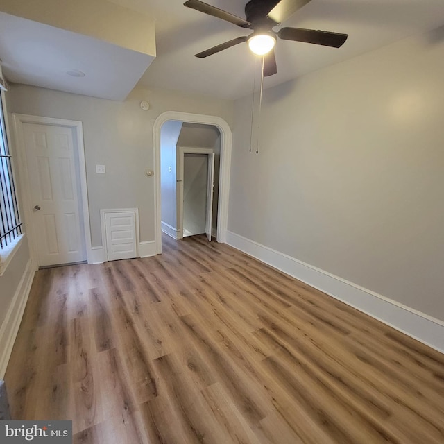 empty room featuring ceiling fan and light hardwood / wood-style flooring