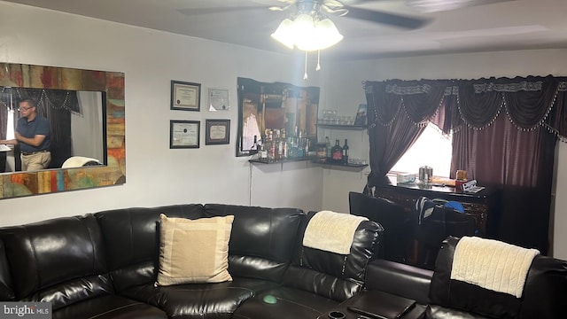 living room featuring ceiling fan