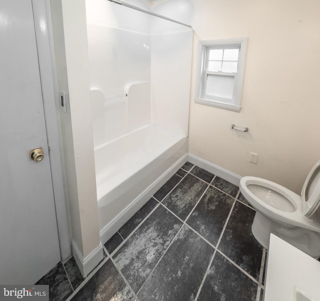 bathroom with toilet and shower / bath combination