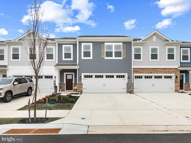 townhome / multi-family property featuring a garage