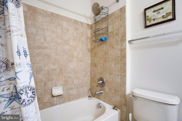 bathroom featuring toilet and shower / bath combo